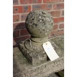 A composite stone garden finial.