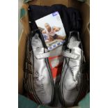 A pair of running spikes signed by Colin Jackson together with a signed photograph.