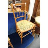 A cane seated occasional chair.