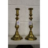 A pair of brass candlesticks.