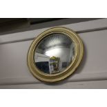 A convex wall mirror.