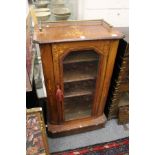 A Victorian inlaid walnut music cabinet.