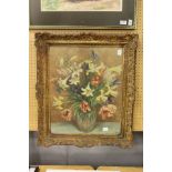 A still life of flowers in a vase. Printed on board, in a decorative frame.