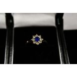 A 9ct gold diamond and sapphire ring.
