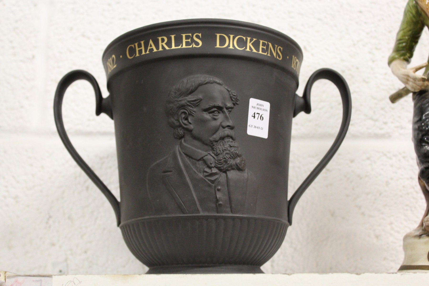 A Royal Doulton black basalt Charles Dickens commemorative twin handled urn.