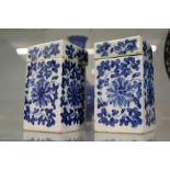 A pair of Chinese blue and white square shaped boxes and covers.