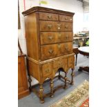 An 18th century walnut chest on later stand comprising two short and three graduated long drawers,