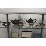 A plated three piece tea service and other plated wares.