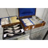 Silver napkins rings, a cased fish set, grapefruit spoons etc.