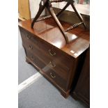 A mahogany chest of two short and two long drawers.