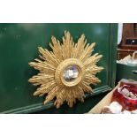 A gilt wood sunburst mirror.