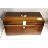 A George III mahogany tea caddy with fitted interior.
