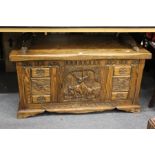 A carved oak reproduction coffer.