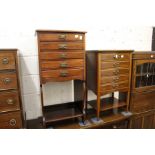 Two mahogany music cabinets.