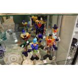 A group of five Murano glass clowns.