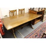 An oak refectory style dining table.