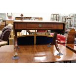 A Regency design mahogany sofa table with a single drawer on splay legs with brass caps and