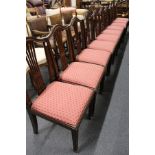 A set of ten Hepplewhite style mahogany dining chairs with drop-in seats.