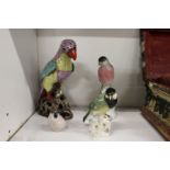 A group of porcelain bird ornaments.