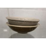 Two early Chinese glazed terracotta bowls.