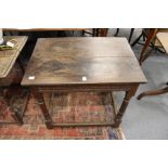 An 18th century and later oak occasional table.