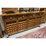 A Spanish style hardwood sideboard.