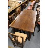 An oak rectangular drawer leaf dining table.