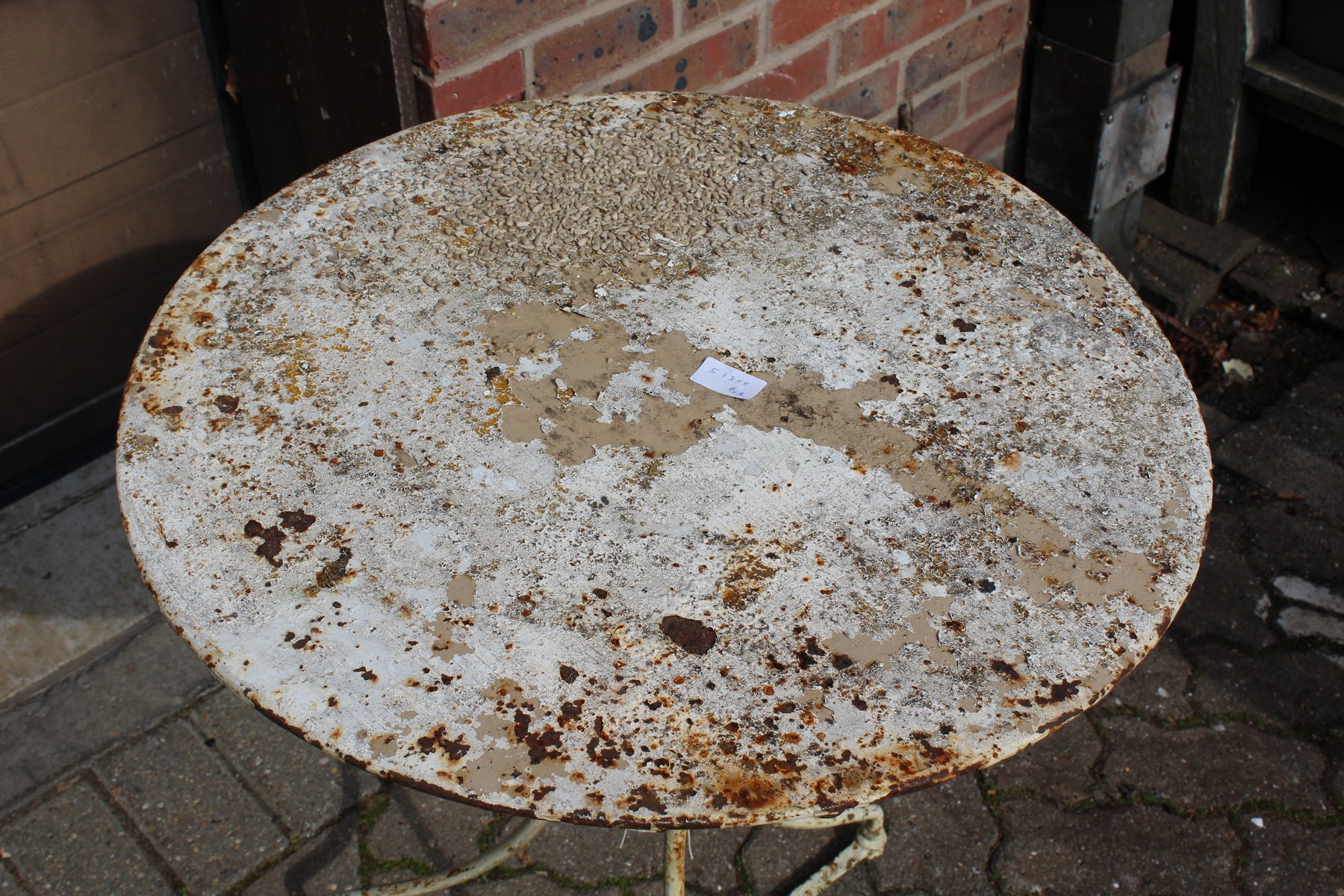 A small white painted wrought iron bistro table. - Image 2 of 2