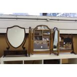 Three dressing table mirrors.