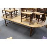 A good large pine trestle table with rounded rectangular top on chamfered square supports, united by