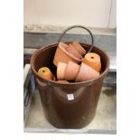 A quantity of terracotta plant pots.