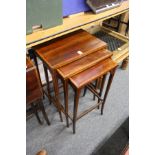 An Edwardian inlaid mahogany nest of tables.