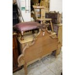 A pine single headboard, a kitchen chair and a stool.