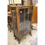 A walnut display cabinet.