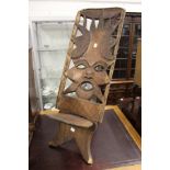 An unusual African carved wood chair.