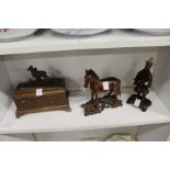 A Black Forest style carved wood casket, mounted with a goat and two other items.