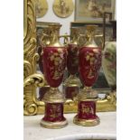 A pair of decorative pedestal vases and bases.