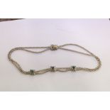A decorative rope twist necklace.
