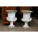 A pair of classical style garden twin handle urns.