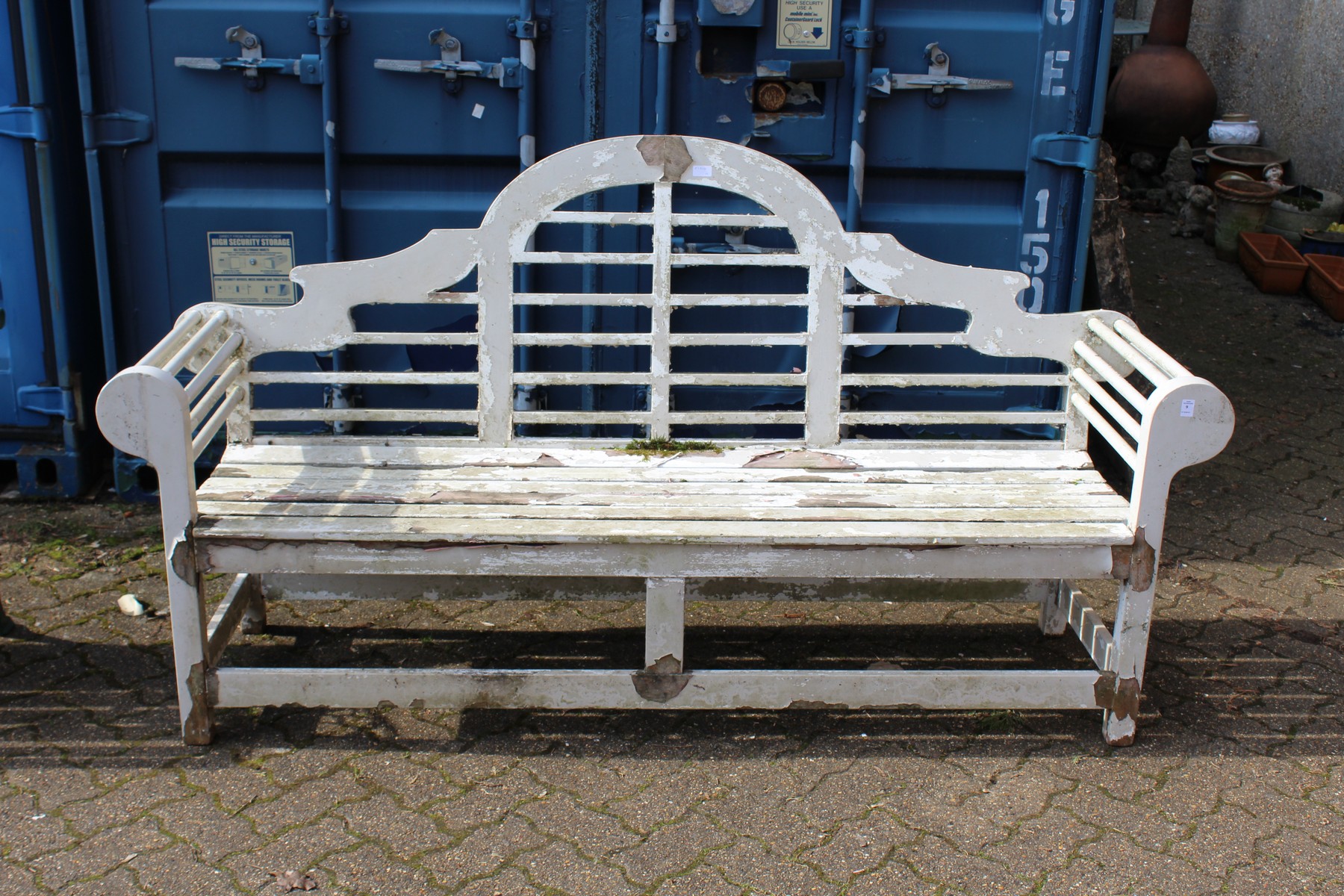 A Lutyens style painted large garden bench.