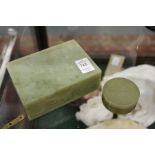 A Chinese jade rectangular box and cover and a similar smaller circular box and cover.