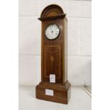 An Edwardian inlaid mahogany miniature longcase clock.