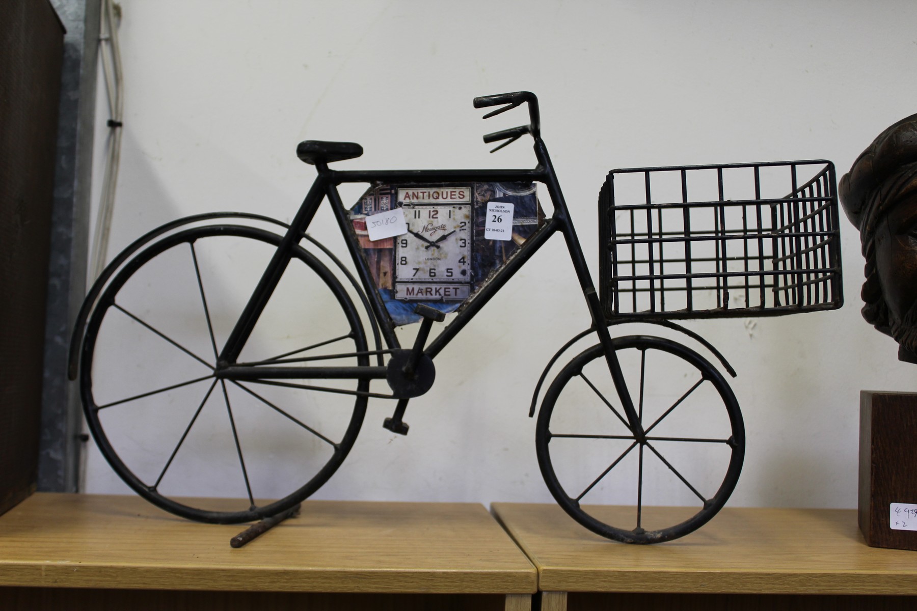 A wrought iron model of an advertising bicycle.