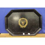 A painted black lacquer octagonal shaped tray.