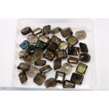 A quantity of rectangular and other tourmaline stones.