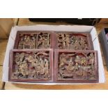 Four small Chinese carved and gilded decorated panels.