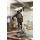 A small bronze figure of a fisherman.