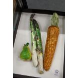 Four pottery and glass moulded fruit and vegetables.