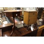 An octagonal gaming / work table together with a bedside cupboard.