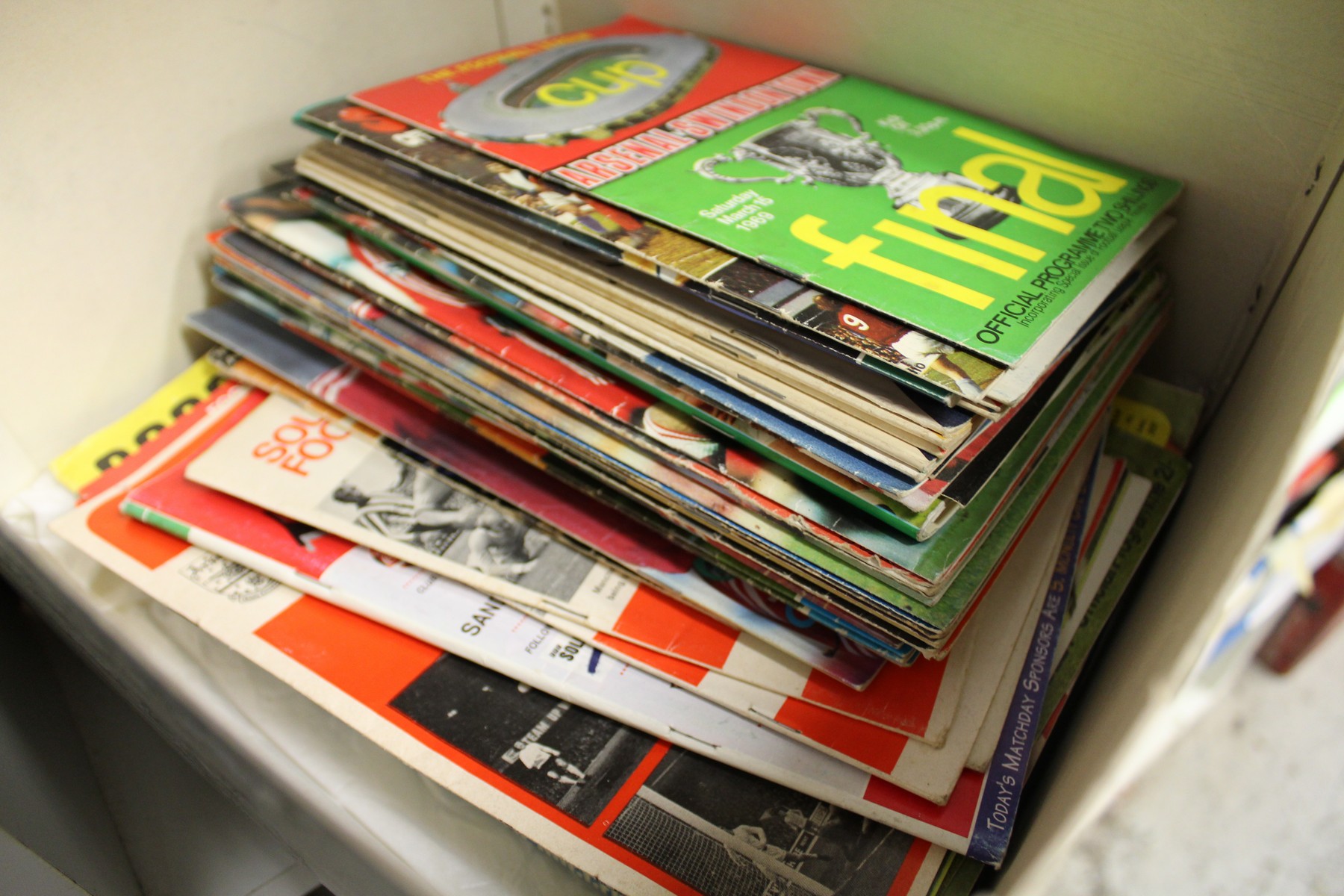 A quantity of football programmes.